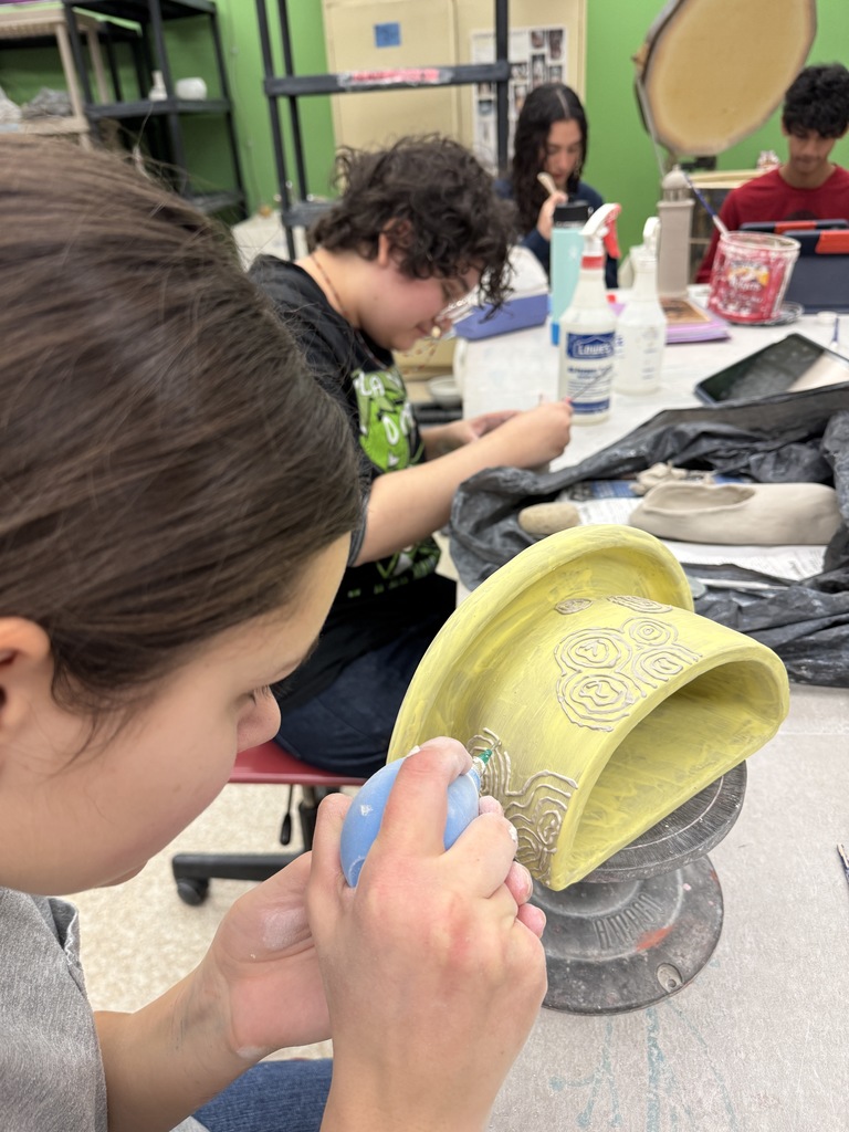 The students in the advanced ceramic class thrive while working on their independent projects.