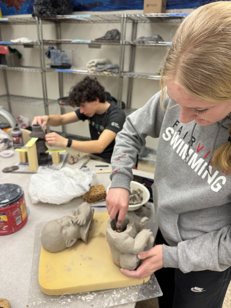 The students in the advanced ceramic class thrive while working on their independent projects.