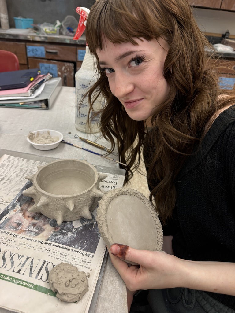 The students in the advanced ceramic class thrive while working on their independent projects.
