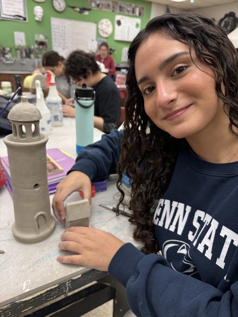 The students in the advanced ceramic class thrive while working on their independent projects.