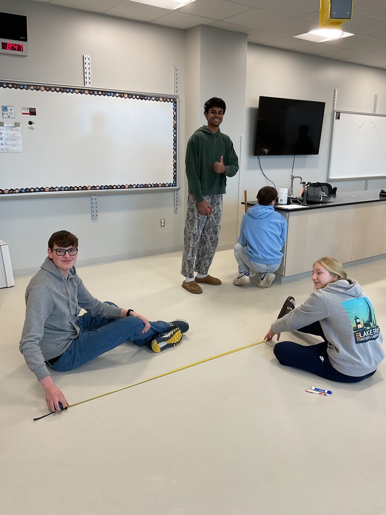 The AP physics class analyzes an angled projectile motion of a sphere in order to determine the range, max height and the time in air.