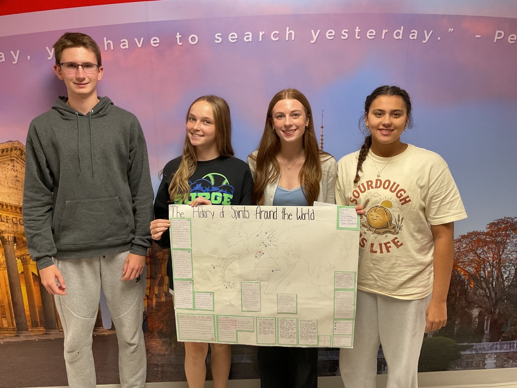 students holding folders