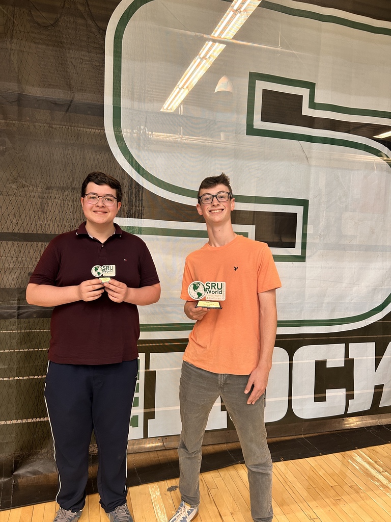 2 students holding awards
