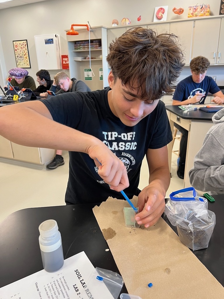 students working with dirt samples