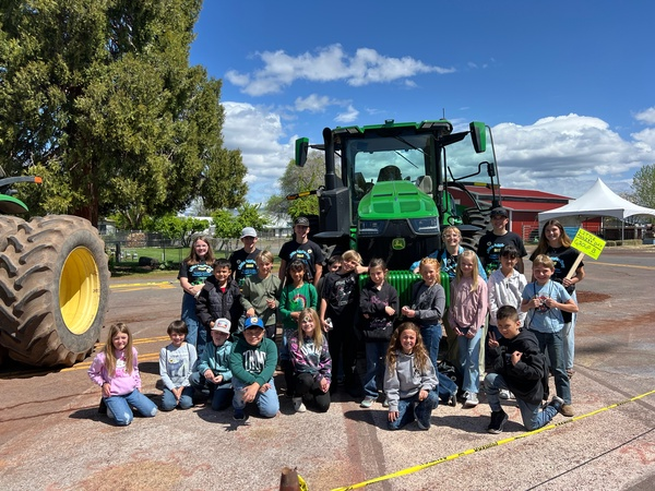 class in front of tractor