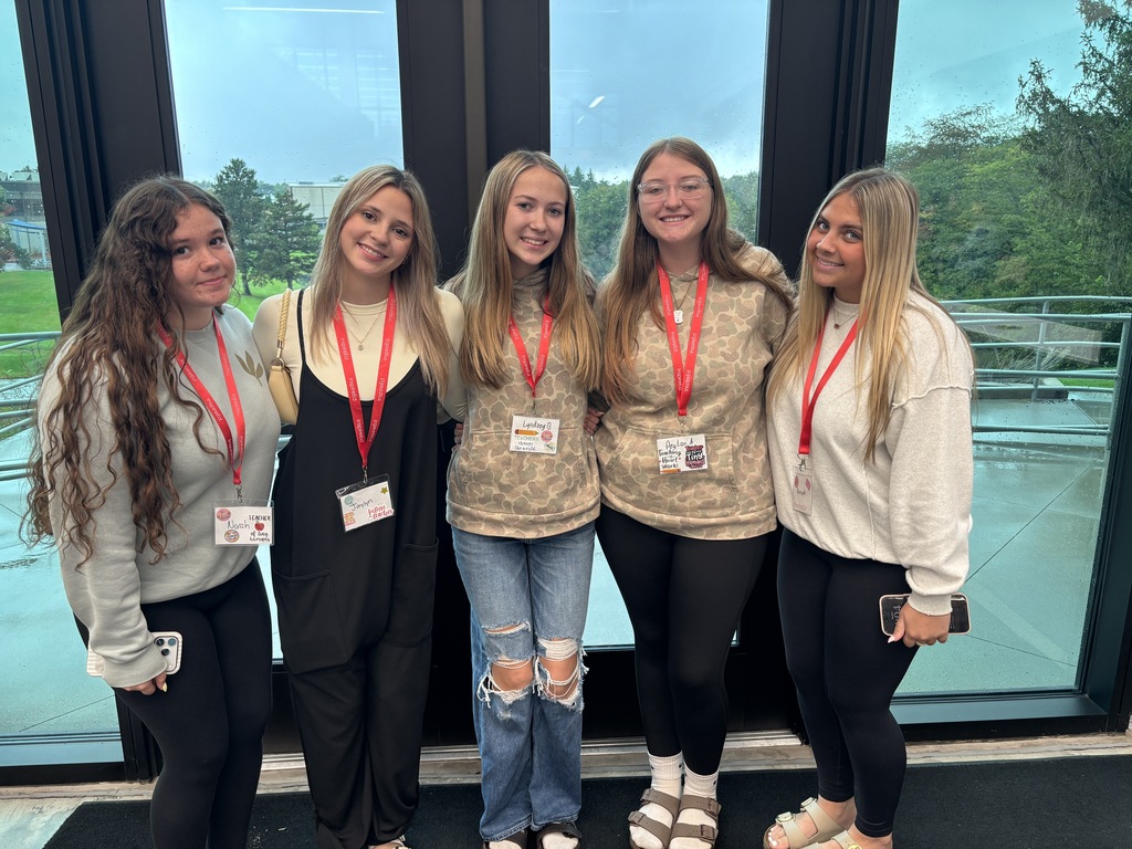 5 students pose for a photo at Carl Sandburg College's InspirED Conference.