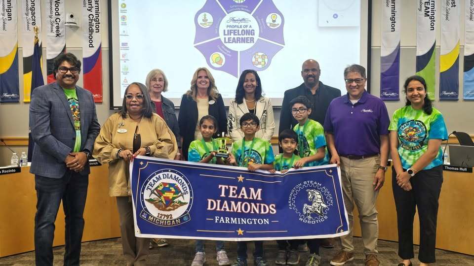 Members of the TEAM Diamonds STEAM team standing with board of education members and superintendent Dr. Kelly Coffin