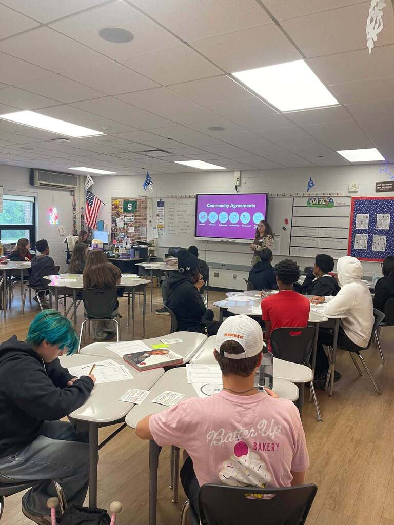 Students watching a presentation at their desks