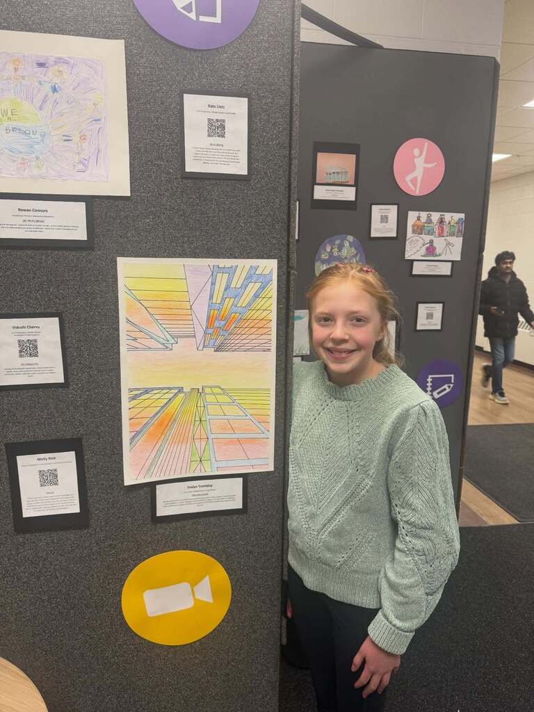 Student standing next to art