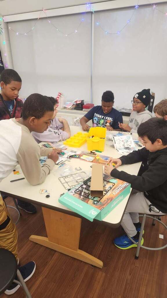 Students working together to create robots