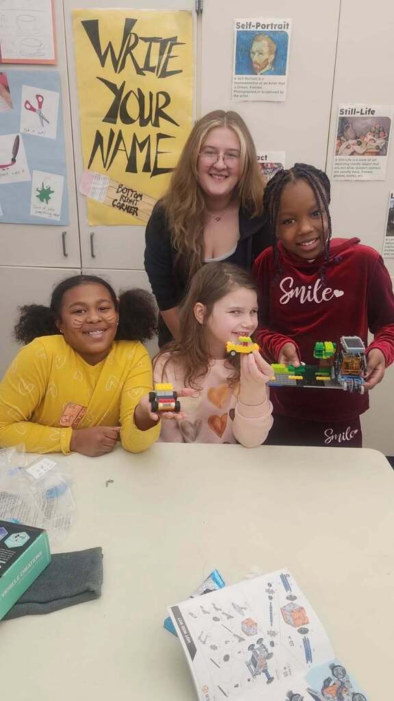 Students showing off their completed projects