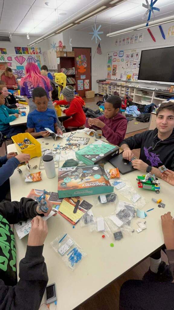 Students working together to create robots