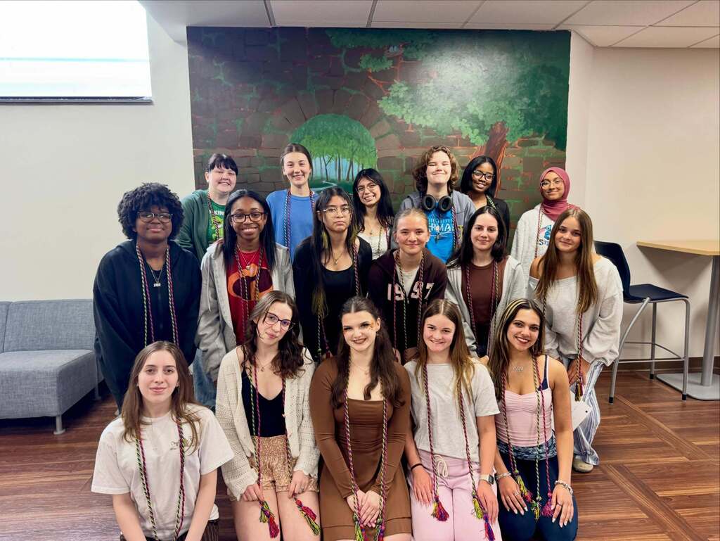 NAHS Students from FHS posing for a photo wearing their graduation cords.