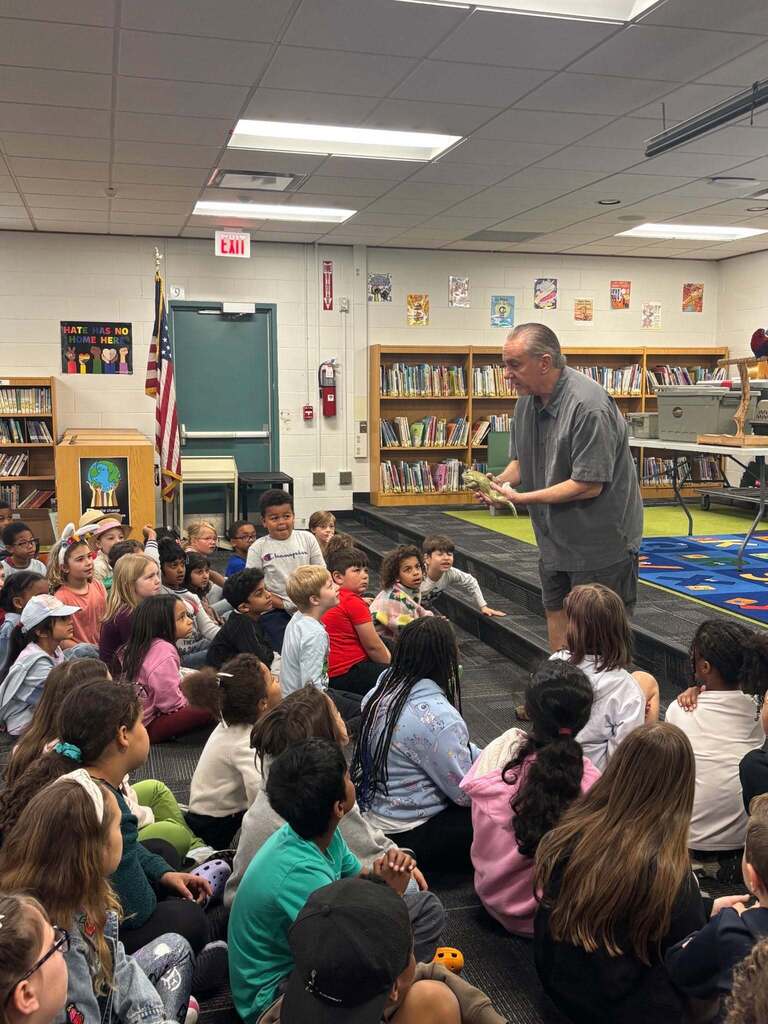 Dan the Creature Man showing Kenbrook students a lizard
