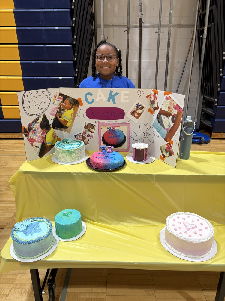 Student sharing her creative cake decorating skills.