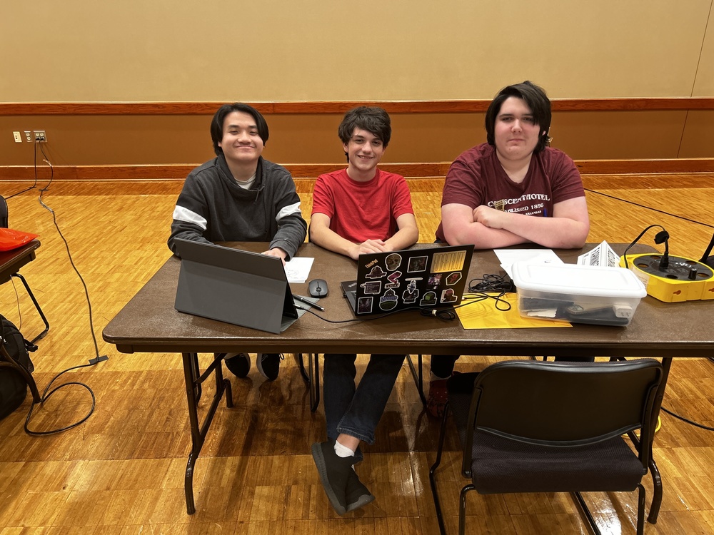 students posing at table