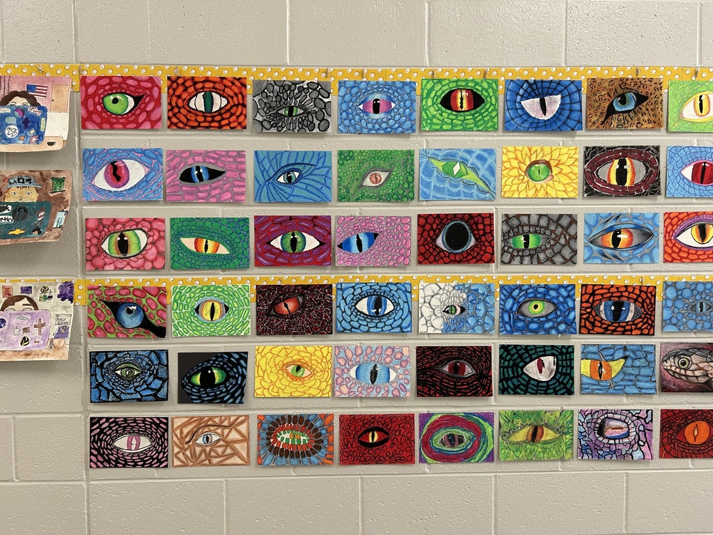 Dragon Eyes artwork hanging in the hallway