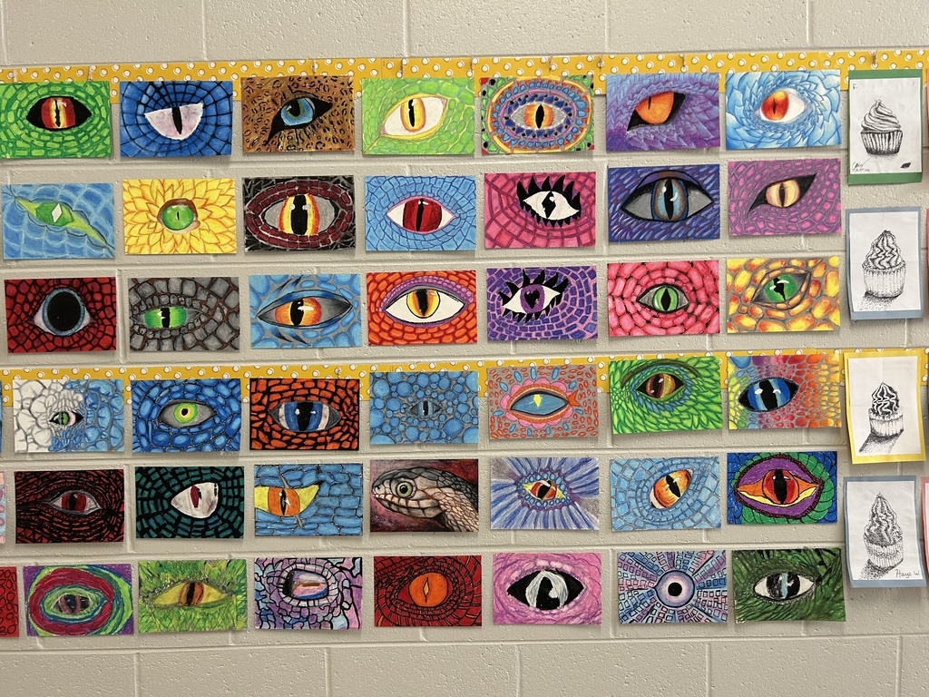 Dragon Eyes artwork hanging in the hallway