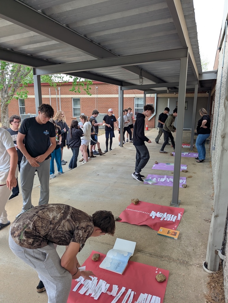 Students compete in a race outside to review what goes into each type of essay