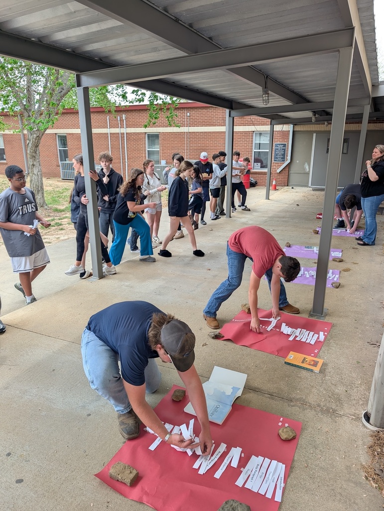 Students compete in a race outside to review what goes into each type of essay