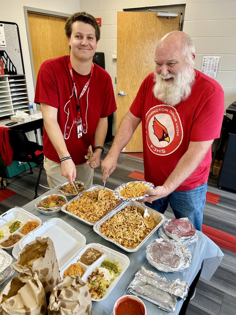2 teachers getting Mexican food in the teachers lounge