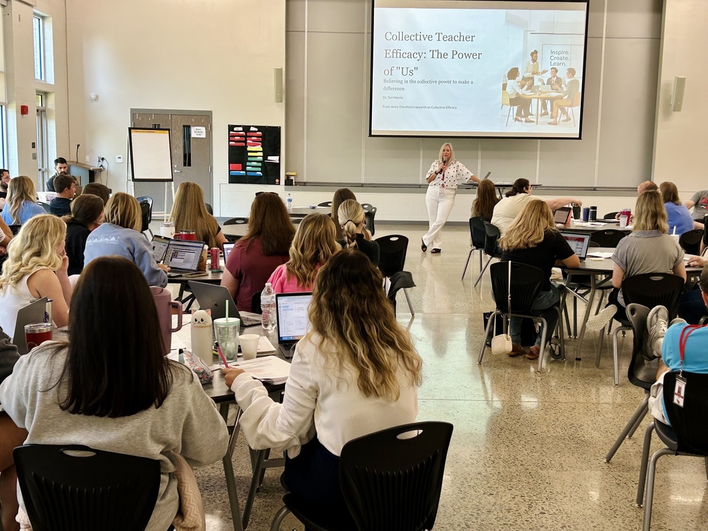 Dr. Morris speaking in front of teachers during professional development