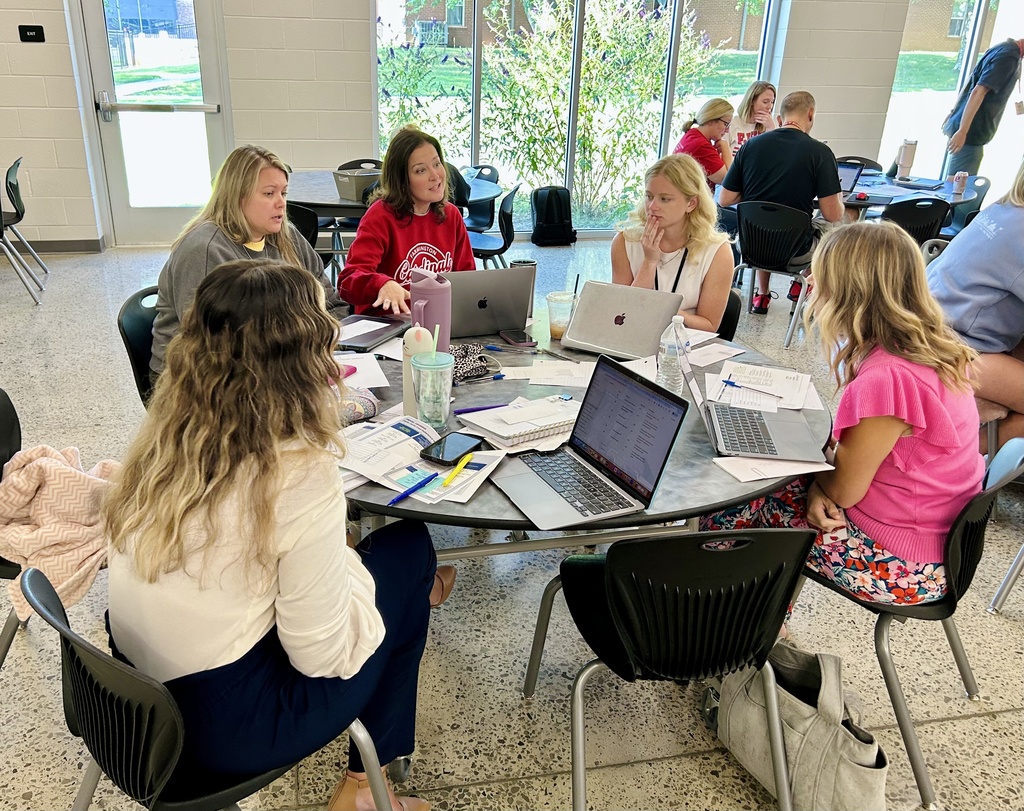 Teachers working together at table