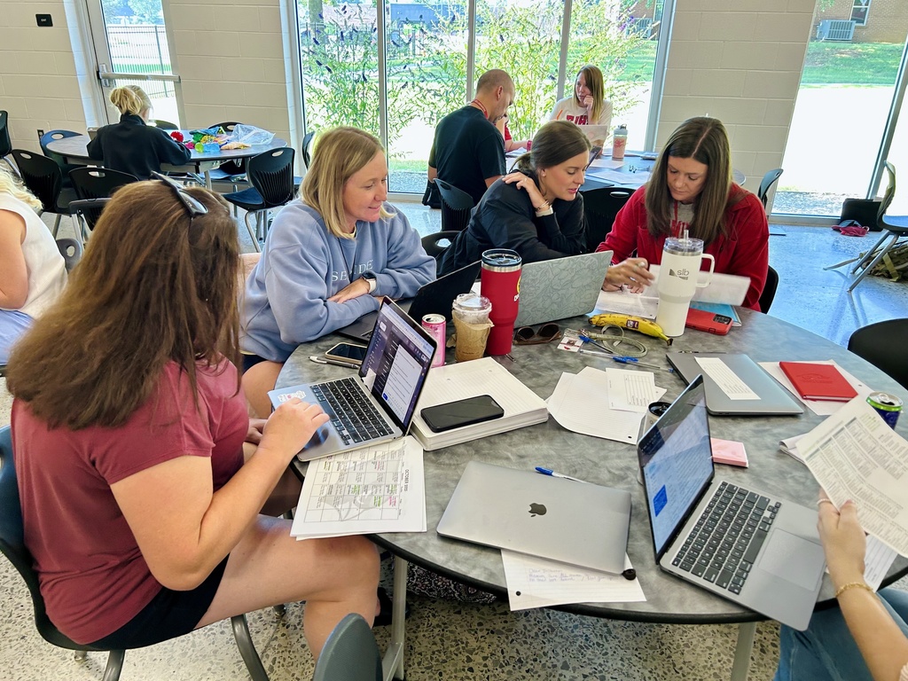 Teachers working together at table