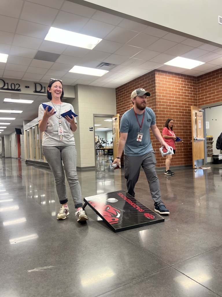teachers playing corn hole