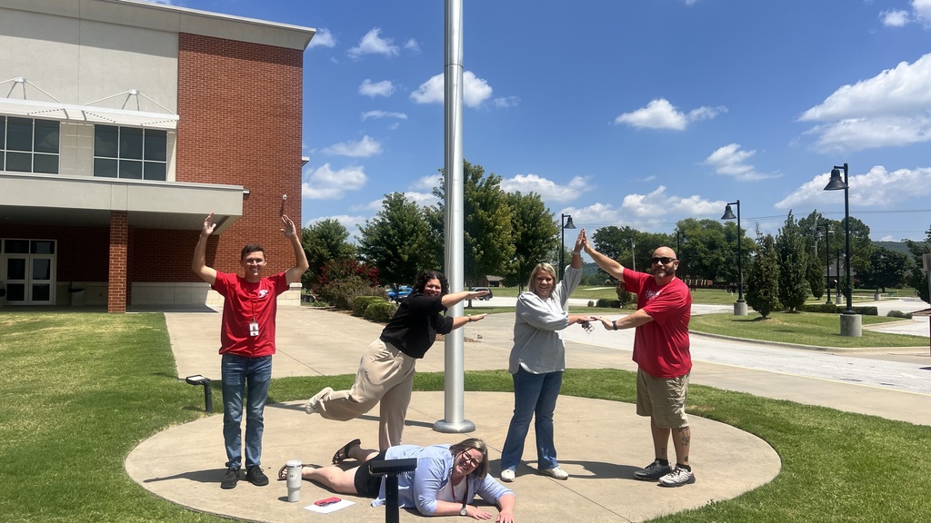 teachers posing outside