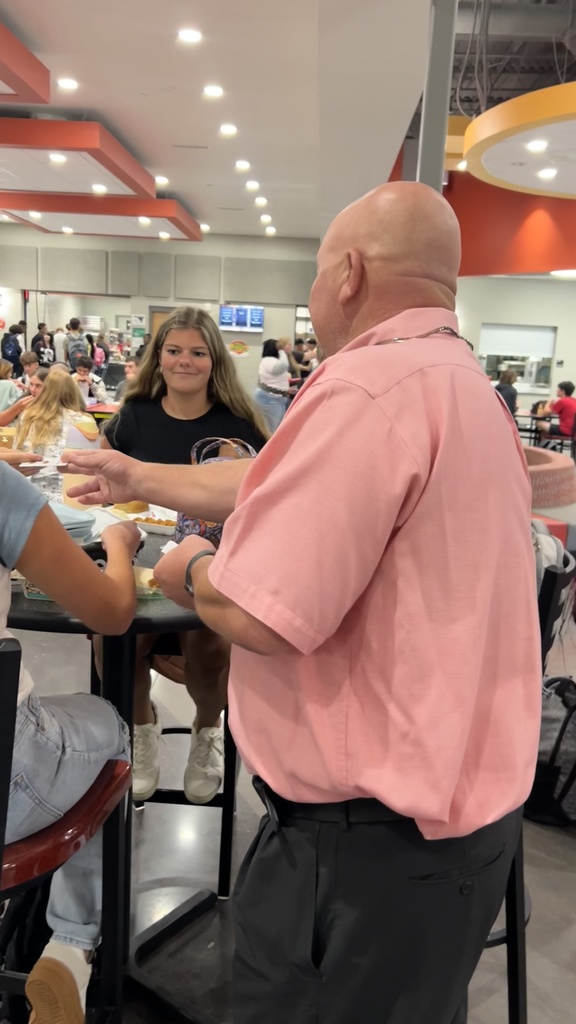 picture of student receiving coupon
