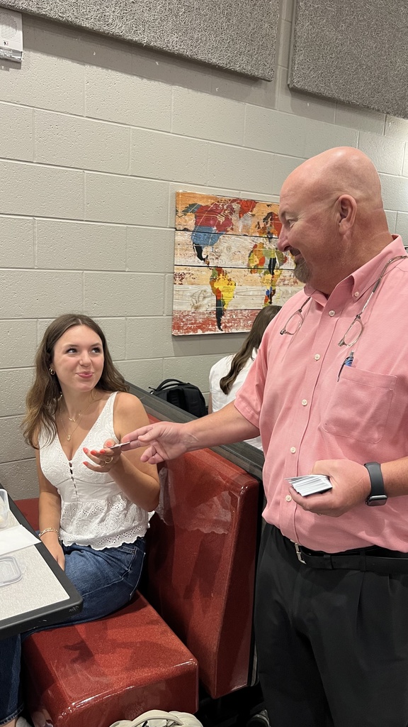 picture of student receiving coupon