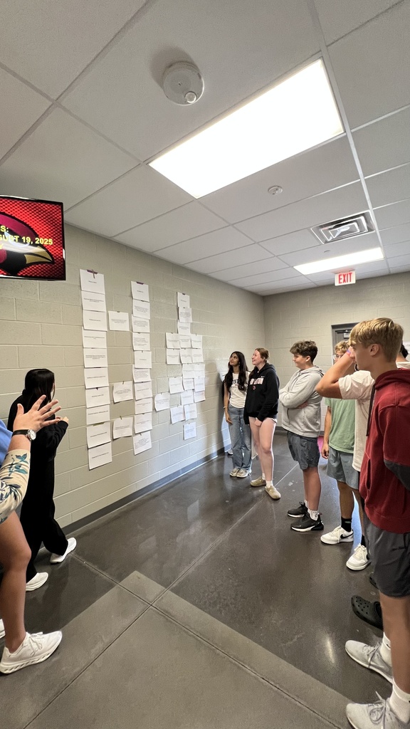students learning in hallway