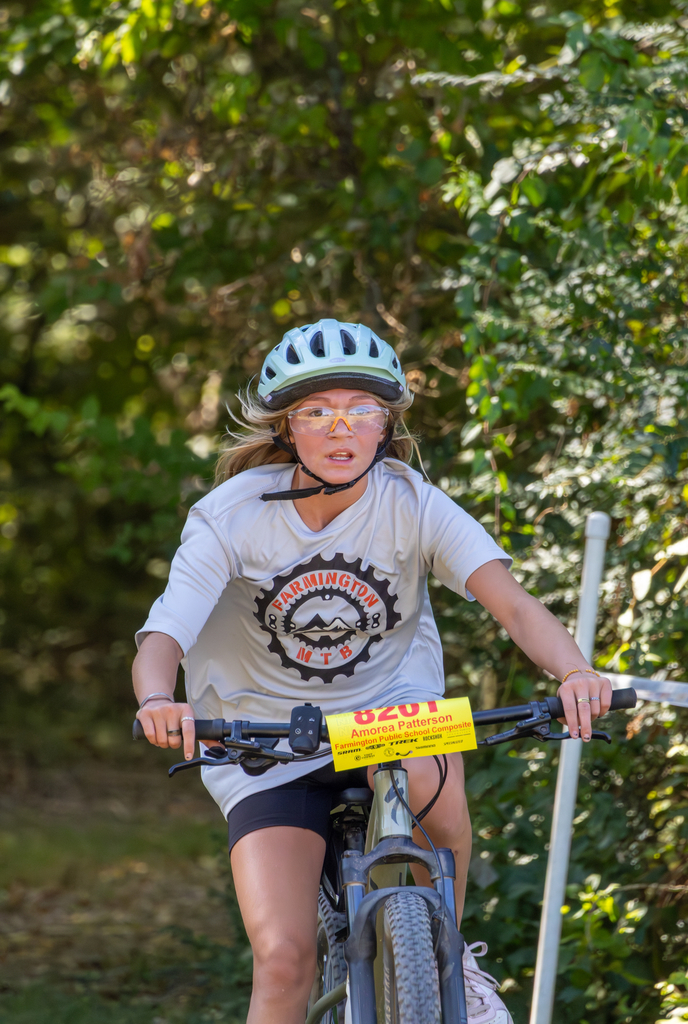 Farmington student concentrates as she rides mountain bike