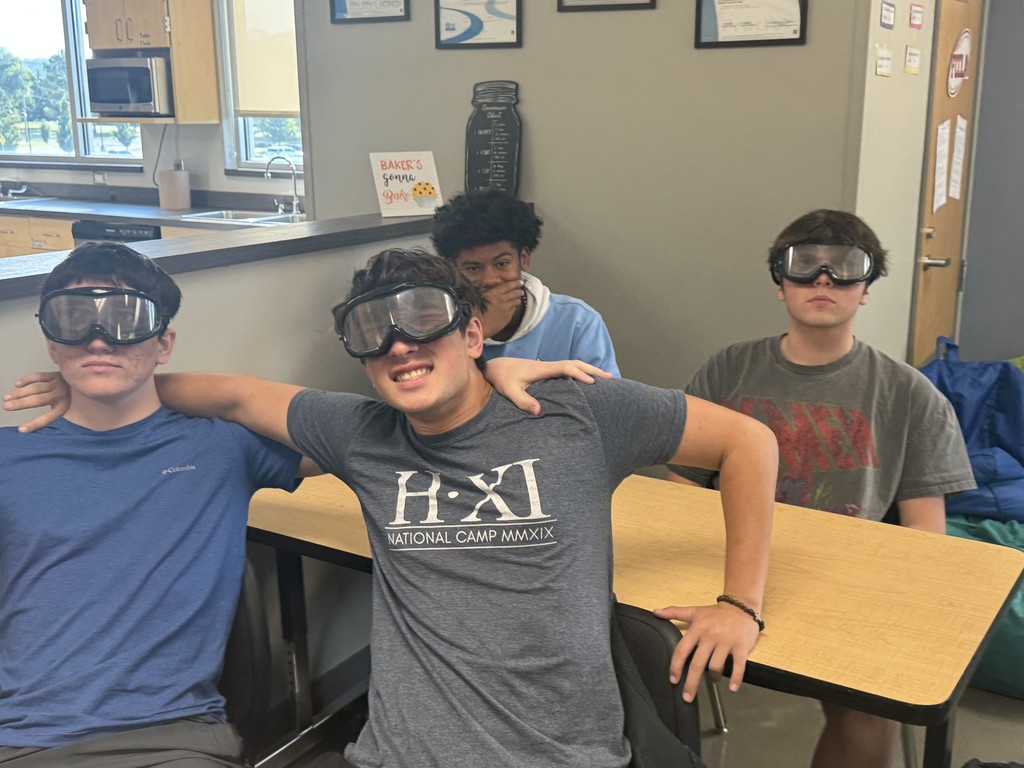 students wearing goggles in class while doing a field sobriety test