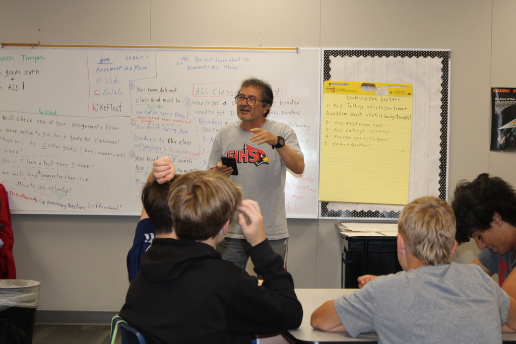 Mr. timjani asking people for the answers to the riddles