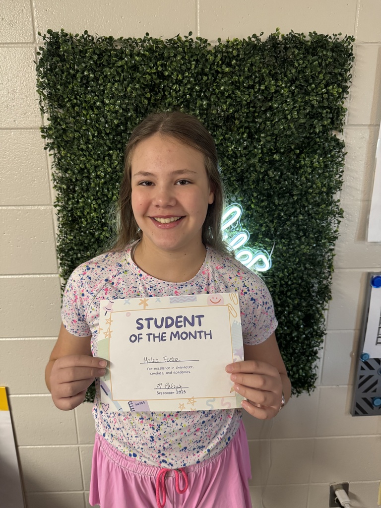 Student posing with certificate