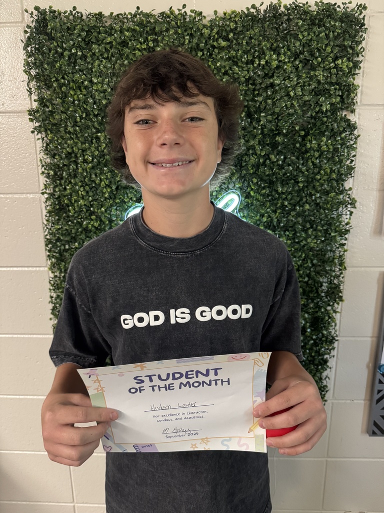 Student posing with certificate