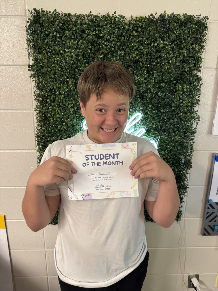 Student posing with certificate