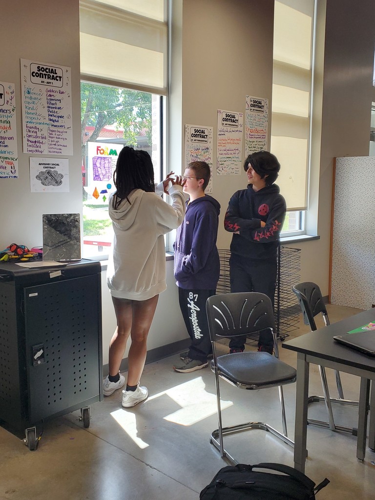 Students standing in the art room