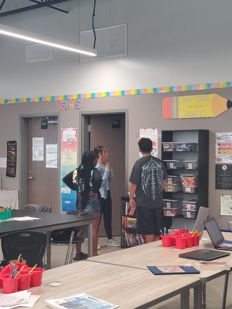 Art students standing in the art room