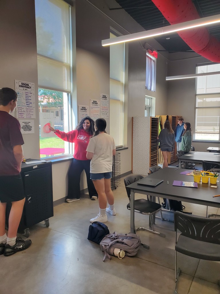 Students standing in the art room 