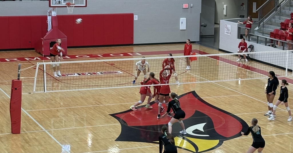 Volleyball player serves the ball
