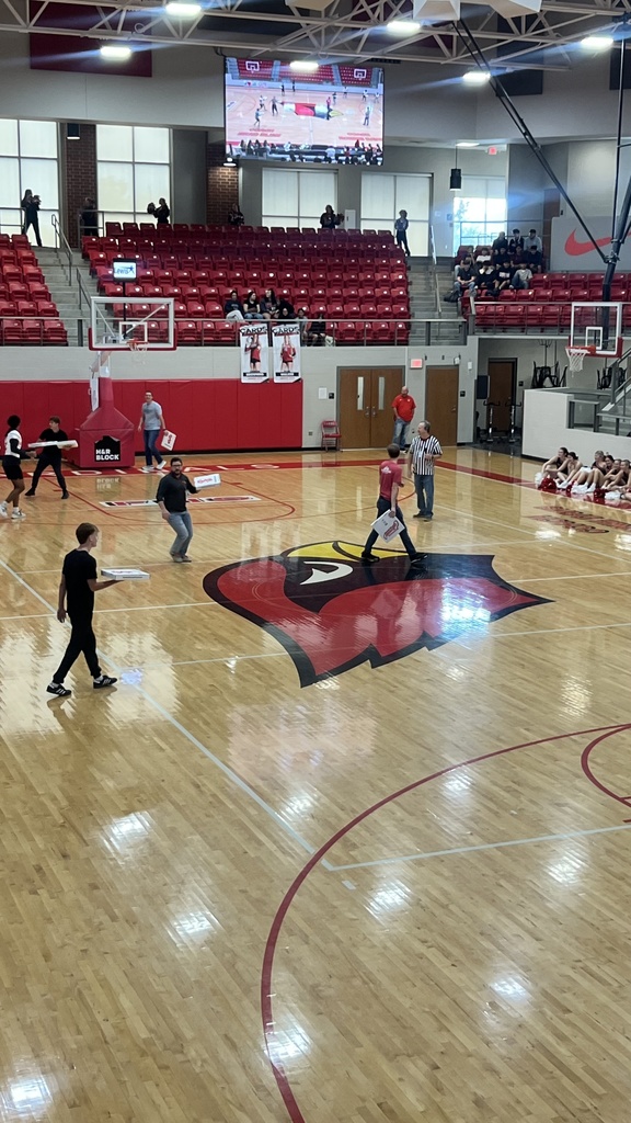 students playing game on court 
