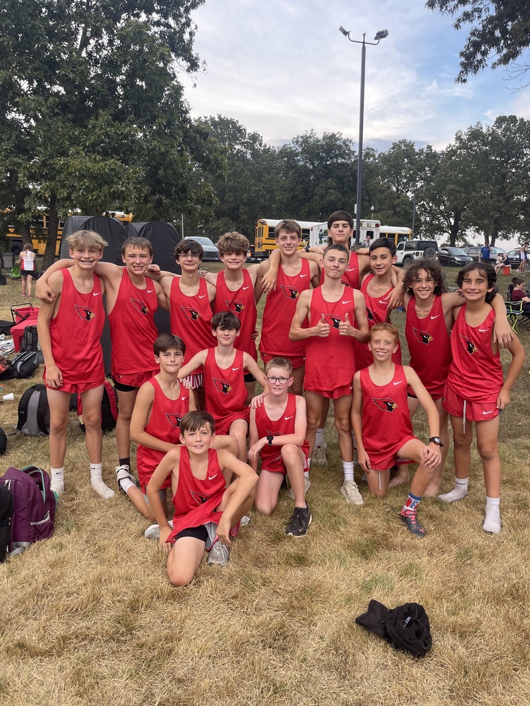 Jr. Boys XC team posing for photo at event