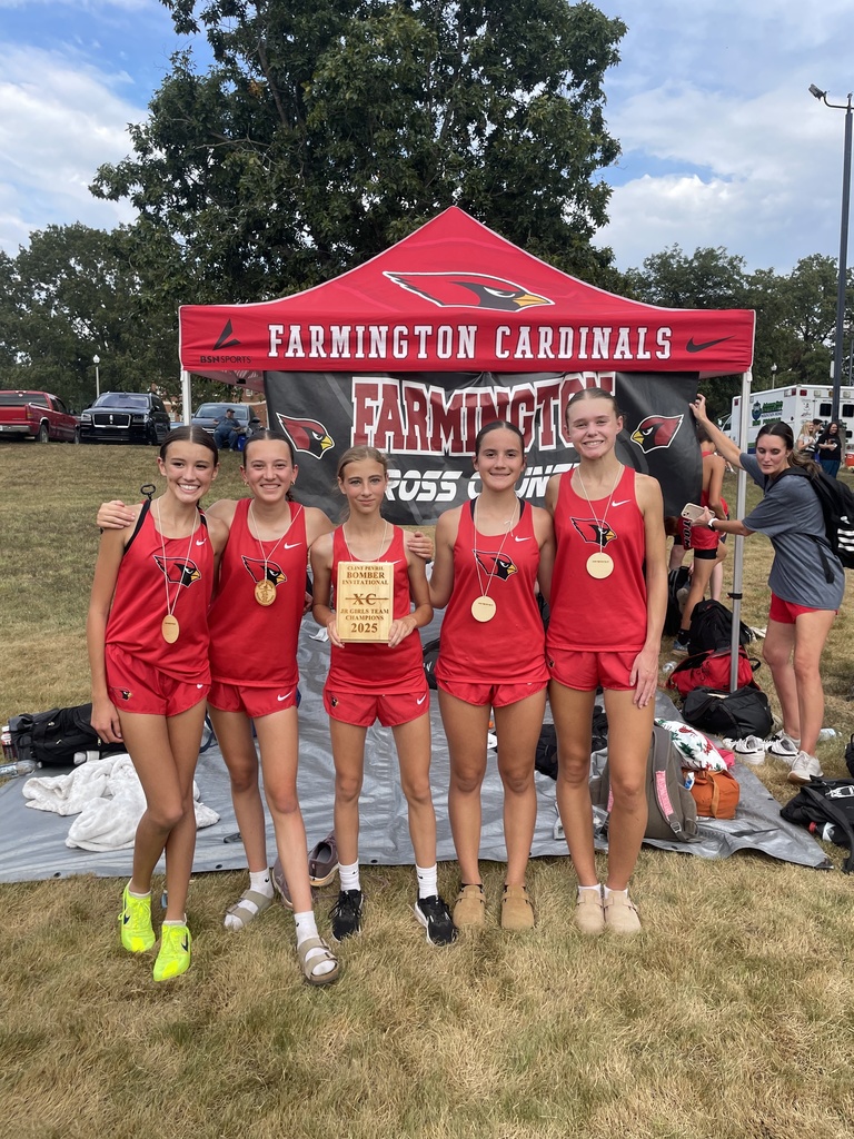 Jr. Girls XC team holding up their 1st place plaque
