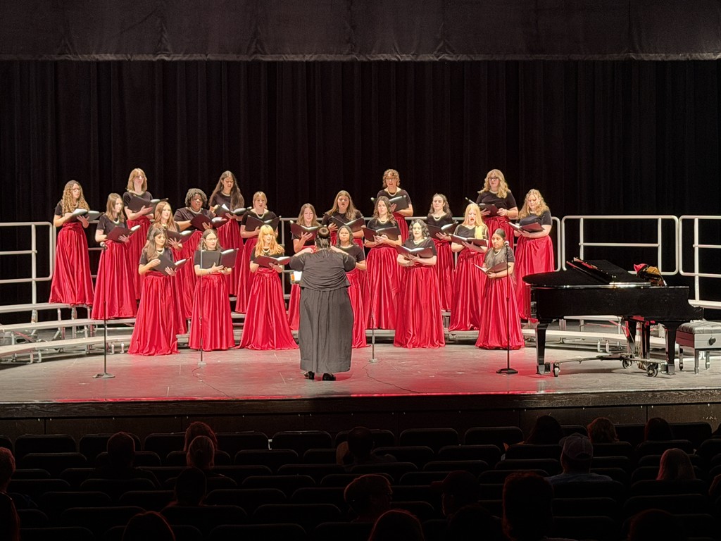 students singing on stage