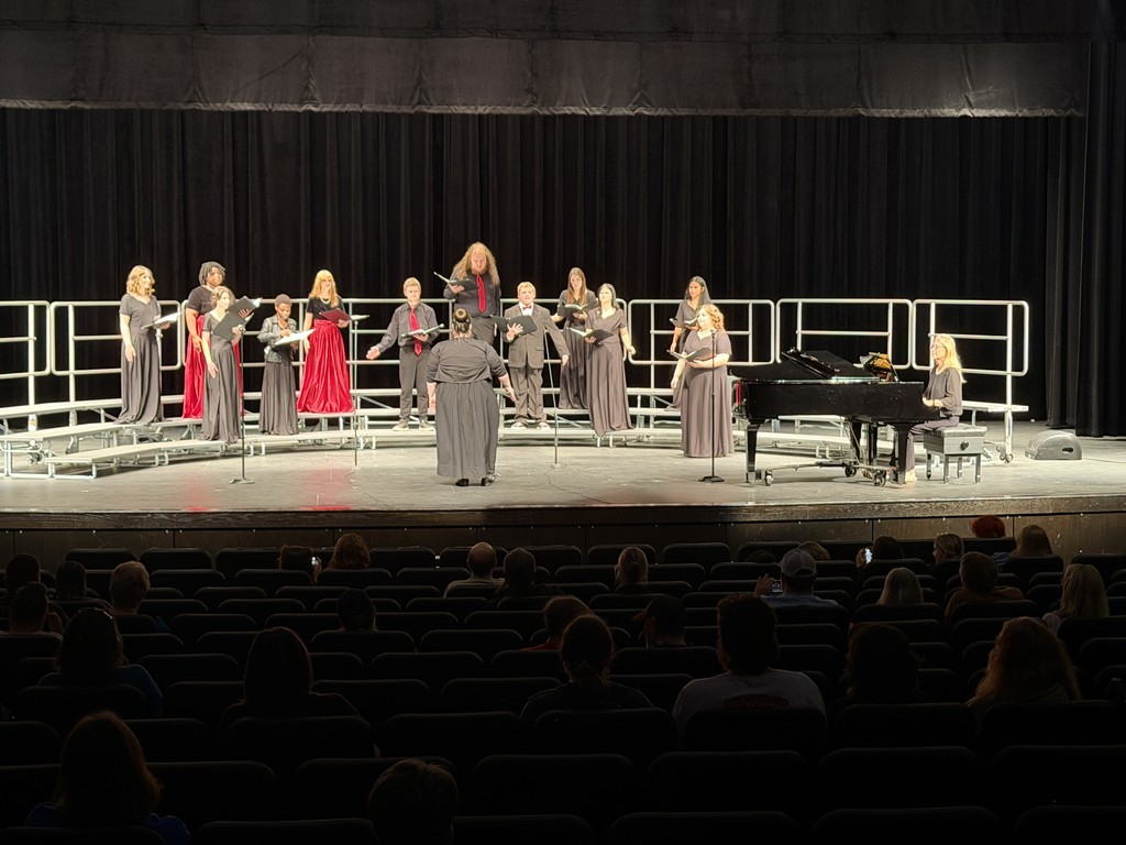 students singing on stage
