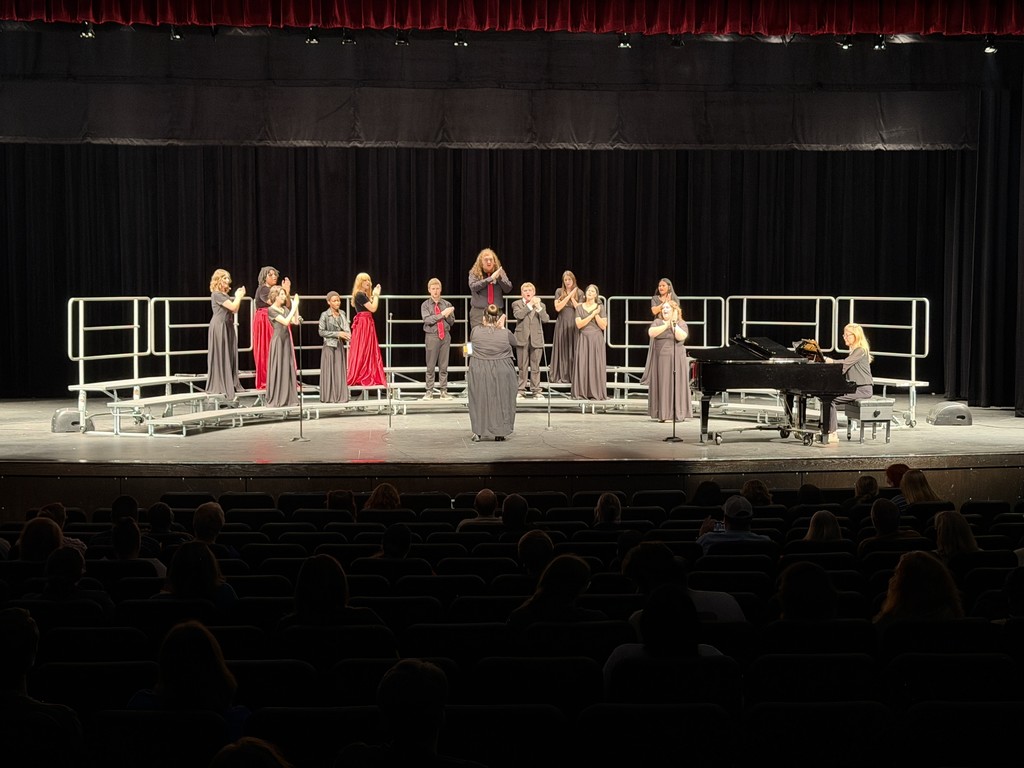 students singing on stage
