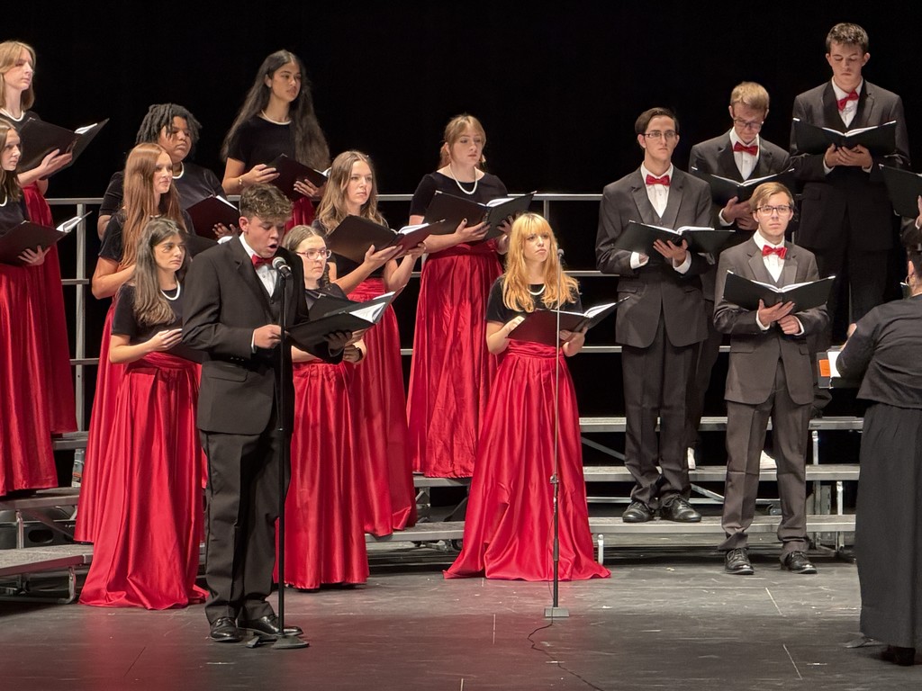 students singing on stage